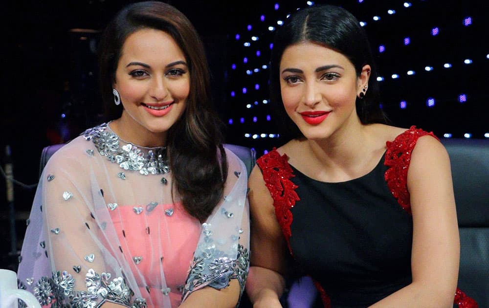 Bollywood actors Shruti Hassan and Sonakshi Sinha during the promotion of film Welcome Back on the sets of Indian Idol Junior, in Mumbai.