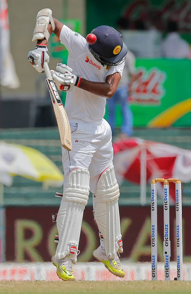 A bouncer bowled by India's Ishant Sharma hits Sri Lankan batsman Lahiru Thirimanne on his helmet on the final day of their third test cricket match in Colombo, Sri Lanka.