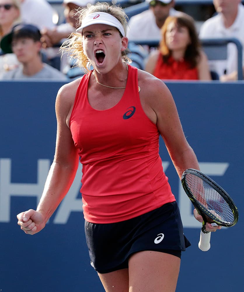 Coco Vandeweghe, of the United States, reacts after beating Sloane Stephens, of the United States, during the first round of the US Open tennis tournament.