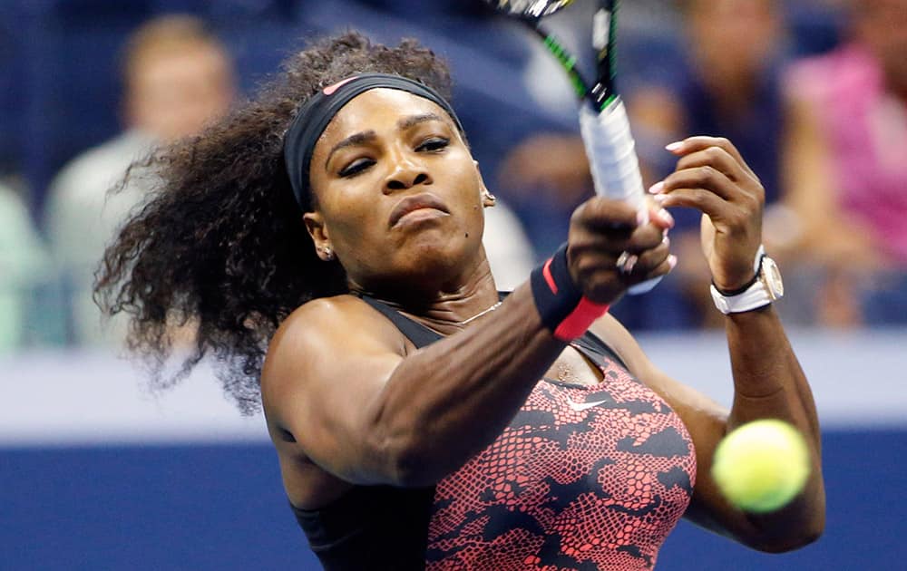 US Open defending champion Serena Williams of the United States returns the ball during her first round match against Vitalia Diatchenko of Russia in the US Open Tennis tournament in New York.