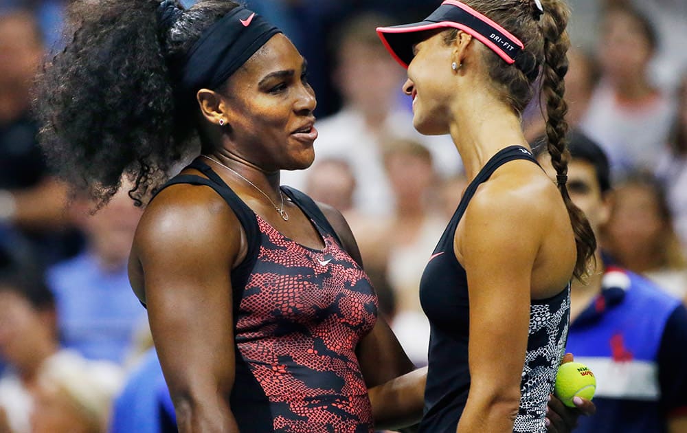 US Open defending champion Serena Williams consoles opponent Vitalia Diatchenko of Russia after Diatchnko stopped playing because of an injury during her first round match against Williams at the US Open Tennis tournament in New York.