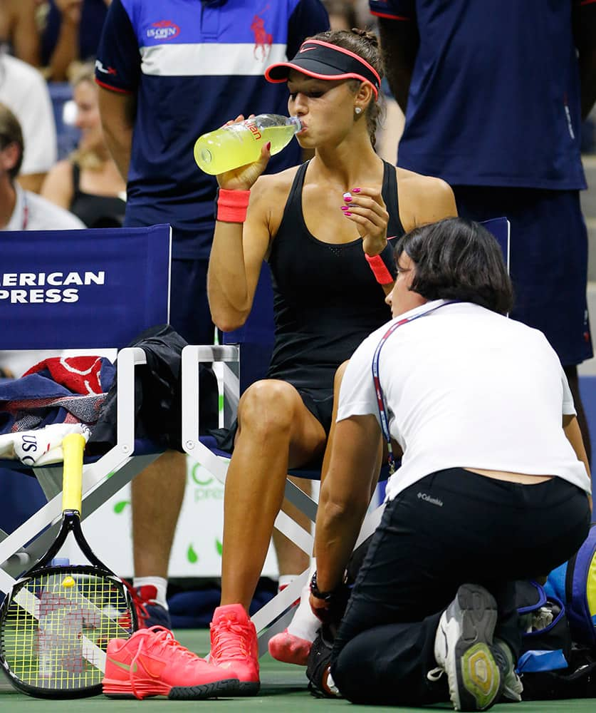 A trainer tends to Vitalia Diatchenko of Russia during her first round match against Serena Williams at the US Open Tennis tournament in New York.