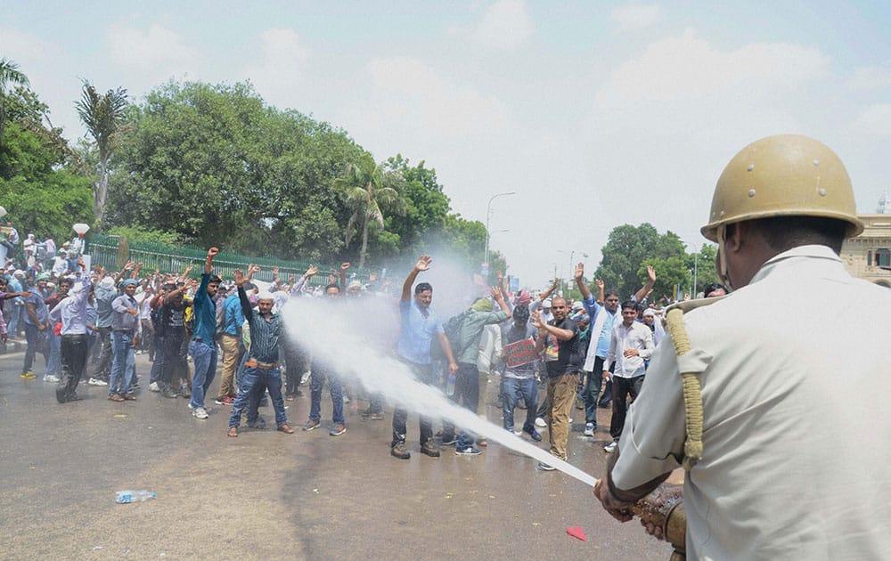 Police using water cannons to disperse B P Ed Sangharsh Morcha members during their protest for jobs in front of Vidhan Sabha in Lucknow.
