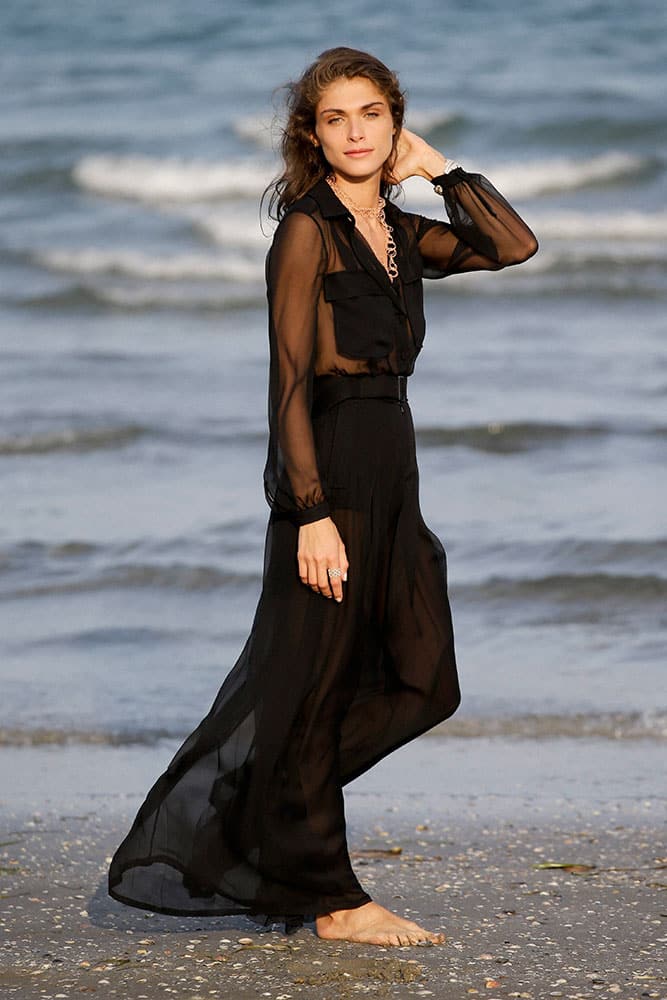 Elisa Sednaoui poses for photographers on the beach of the Venice Lido.
