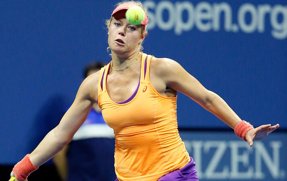 Laura Siegemund, of Germany, returns a shot to Petra Kvitova, of the Czech Republic, during the first round of the U.S. Open tennis tournament in New York.