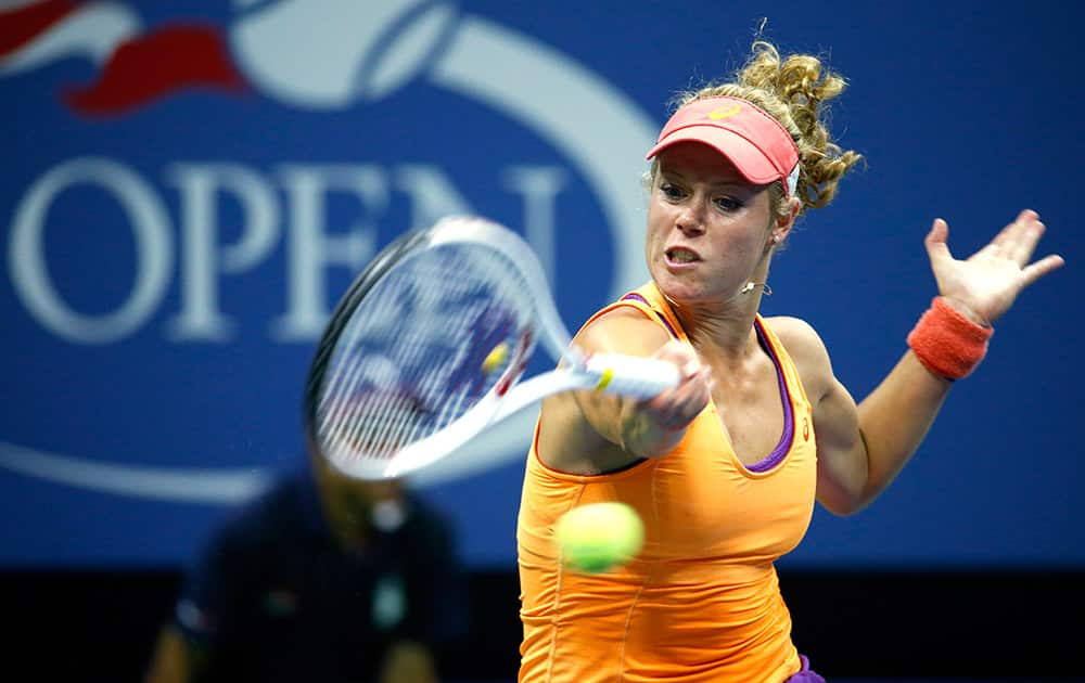 Laura Siegemund, of Germany, returns a shot to Petra Kvitova, of the Czech Republic, during the first round of the US Open tennis tournament in New York.