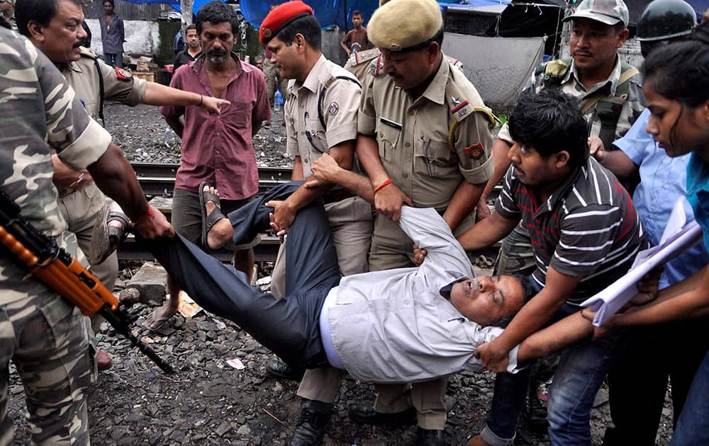 Police arrest activists of the CITU and AITUC who were stopping a train near Guwahati Railway Station during their nationwide strike against the NDA Government’s alleged “anti-worker” policies, in Guwahati.