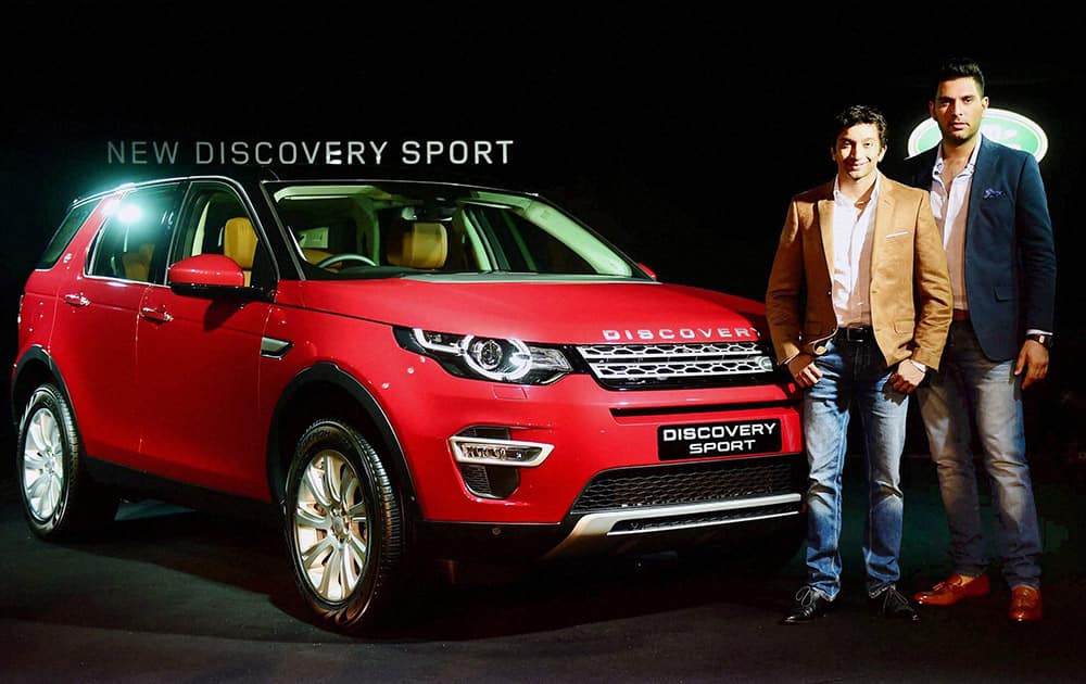 Cricketer Yuvraj Singh and Formula-1 Driver, Narain Karthikeyan during the launch of Land Rover Discovery Sport in Mumbai.