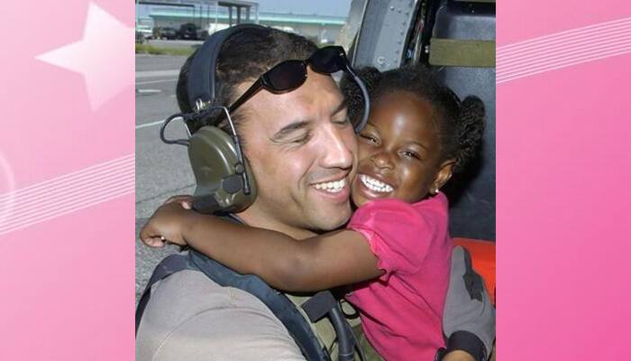 Rescuer to meet kid from Hurricane Katrina hug photo