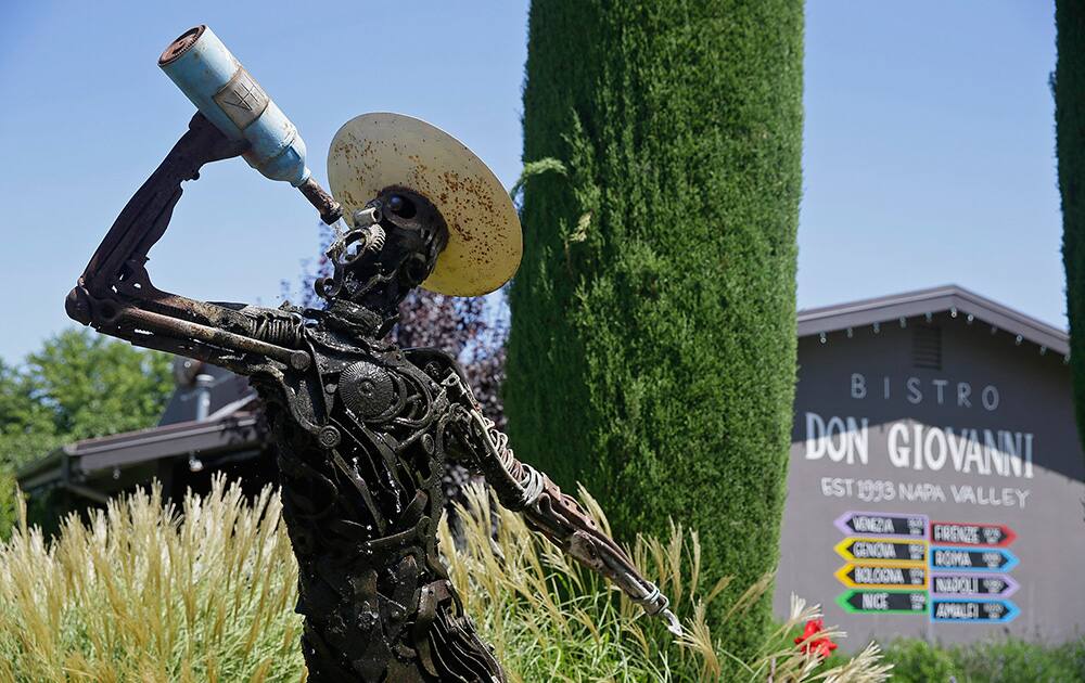 a fountain sculpture appears outside the Bistro Don Giovanni in Napa, Calif. The restaurant is where tourists and locals go to dine; you’ll probably end up sitting next to some of the valley’s movers and shakers although you might not know it. (AP Photo/Eric Risberg)