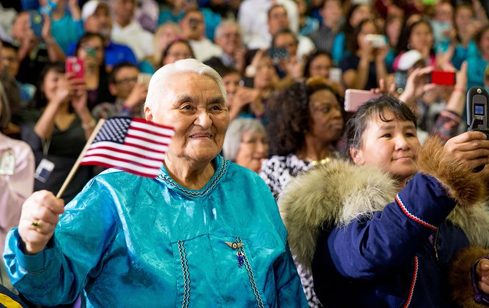 Audience members react as President Barack Obama arrives to deliver remarks at Kotzebue School in Kotzebue, Alaska. 