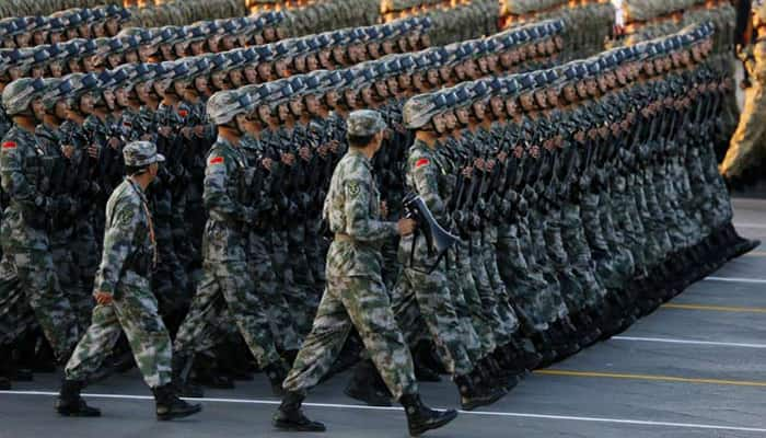 China holds massive military parade, to cut troop levels by 300,000