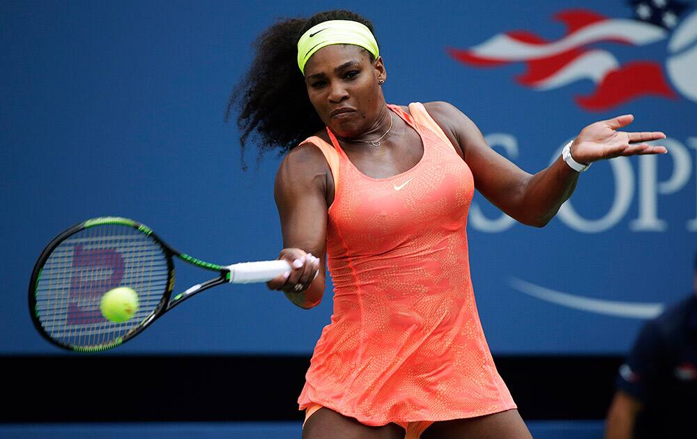 Serena Williams returns a shot to Kiki Bertens, of the Netherlands, during the second round of the US Open tennis tournament.