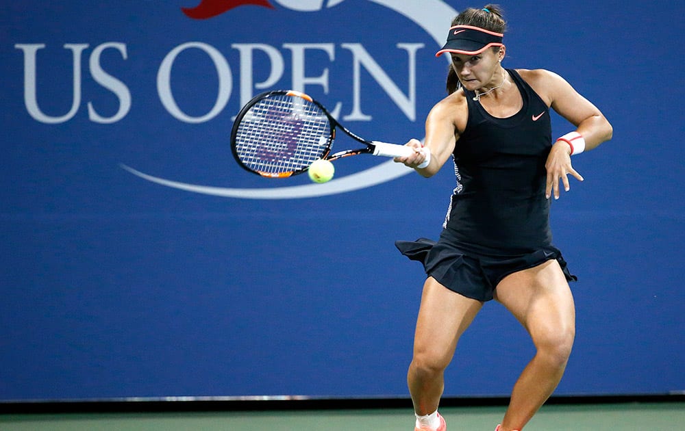 Lauren Davis, of the United Sates, hits a forehand to Ekaterina Makarova, of Russia, during the second round of the US Open tennis tournament in New York.