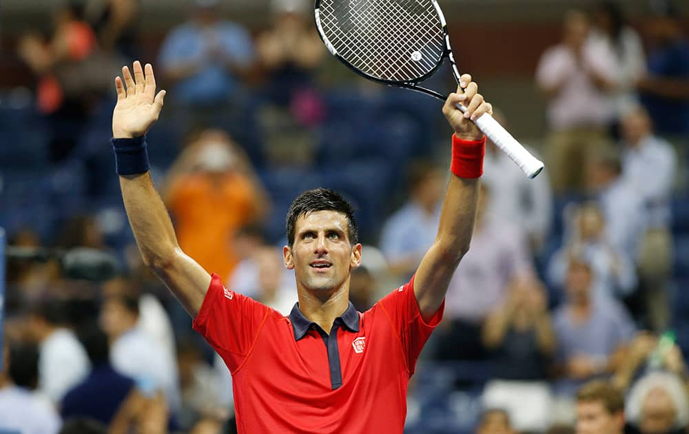 Novak Djokovic, of Serbia, waves to the crowd after defeating Andreas Haider-Maurer, of Austria, 6-4, 6-1, 6-2, in the U.S. Open tennis tournament in New York.