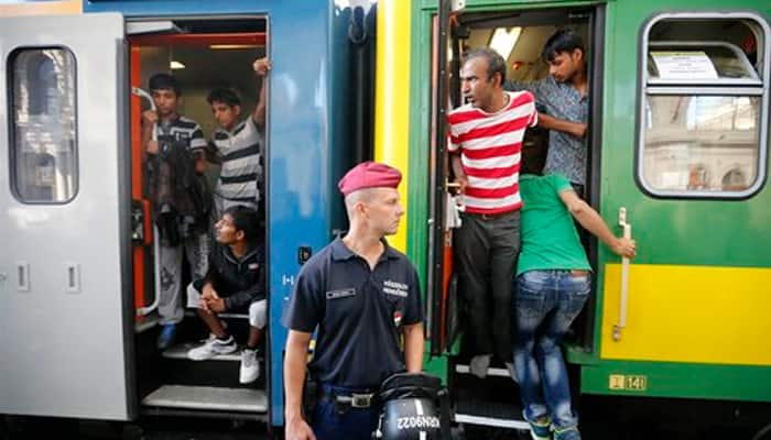 Migrants taken off Hungarian train near refugee camp: State media