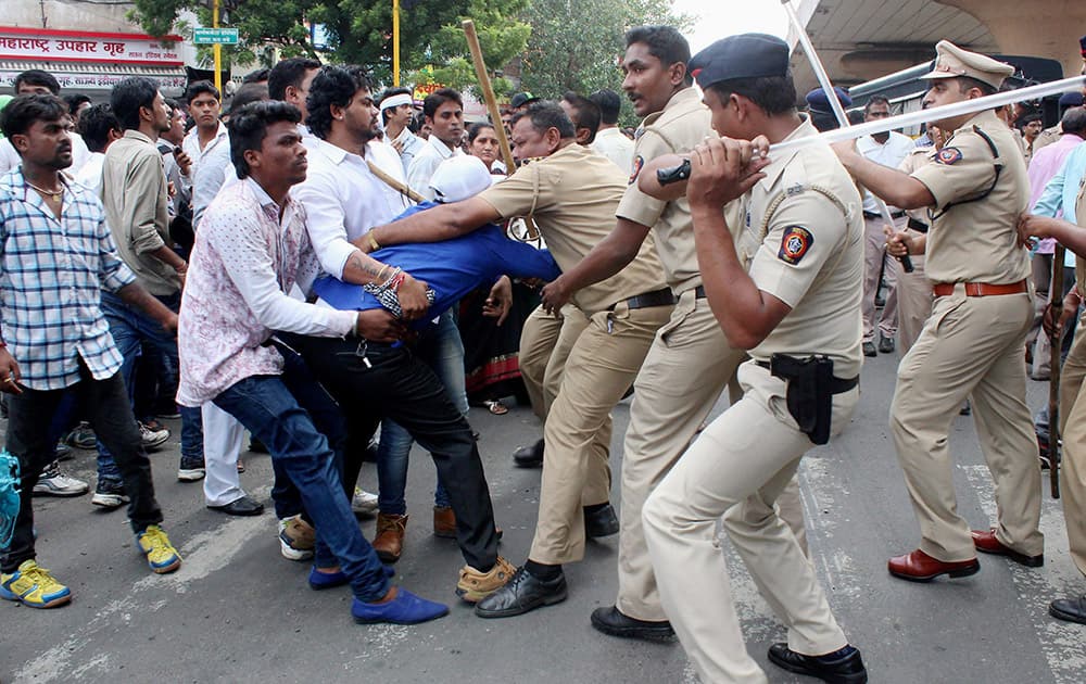 Police lathicharge dalit community members during a protest against Congress MP Vijay Darda and his regional newpaper after it published an article on reservation policy near Lokmat Square in Nagpur, Maharashtra.