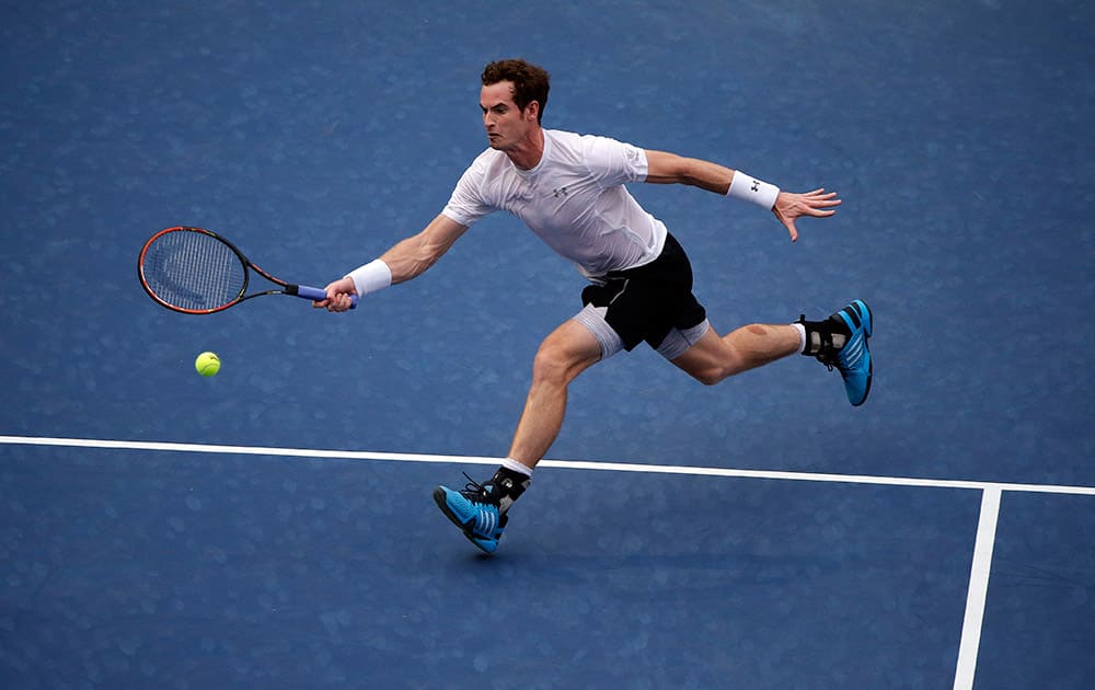 Andy Murray, of the United Kingdom, returns a shot to Adrian Mannarino, of France, during the second round of the U.S. Open tennis tournament.