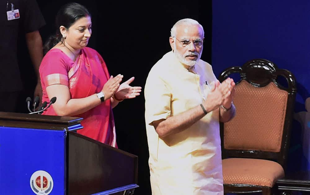 Prime Minister Narendra Modi and HRD Minister Smriti Irani arrive at an interaction with school children, on the eve of Teachers Day at Manekshaw Centre, in New Delhi.