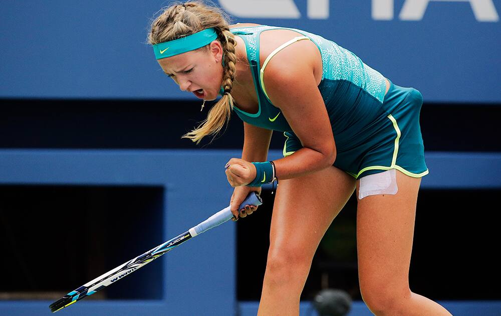 Victoria Azarenka, of Belarus, reacts after a point against Yanina Wickmayer, of Belgium, during the second round of the U.S. Open tennis tournament.