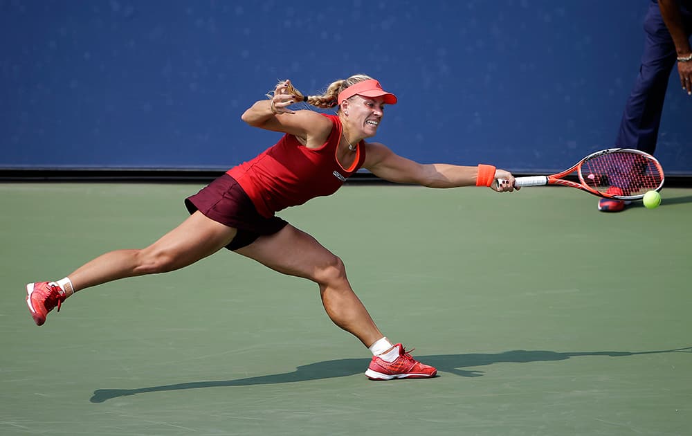 Angelique Kerber, of Germany, lunges to return a serve from Karin Knapp, of Italy, during the second round of the U.S. Open tennis tournament.