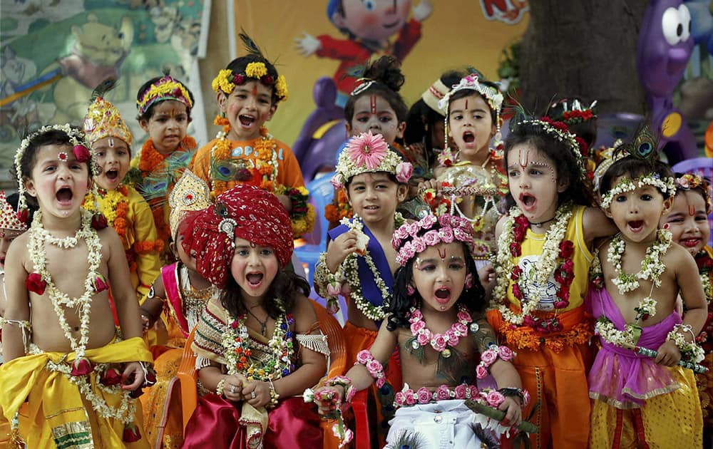 School children dressed as Lord Krishna take part during the Krishna Janmashtami celebrations in Ajmer.