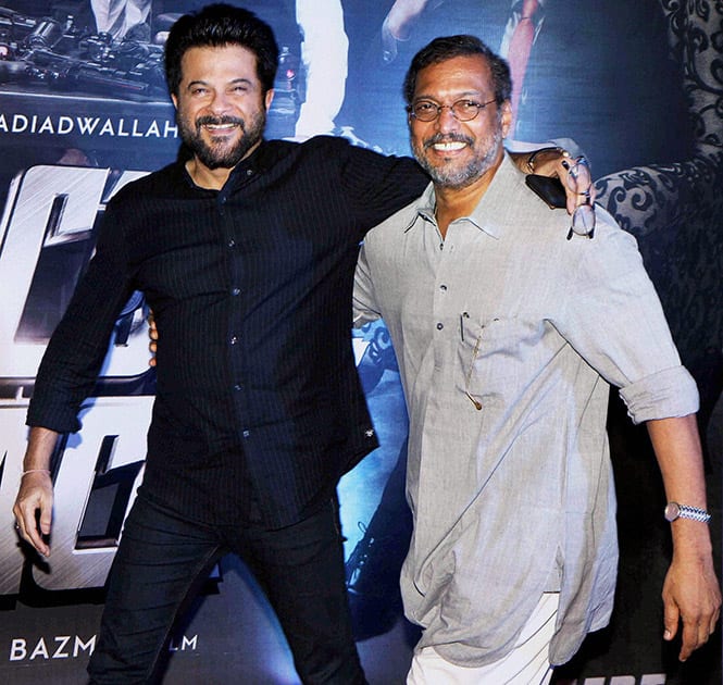 Anil Kapoor and Nana Patekar pose for a photograph during the premiere of film Welcome Back in Mumbai.