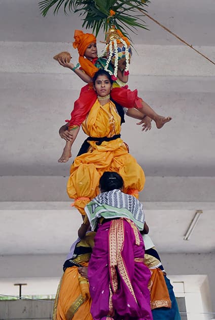 Students from a girls college celebrate Dahi Handi festival in Mumbai.