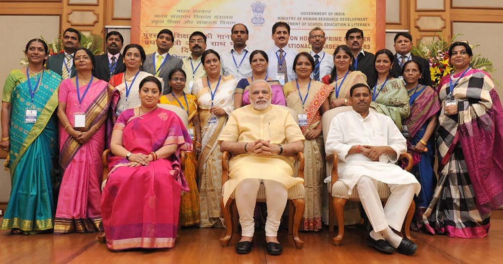 Prime Minister Narendra Modi in a group photograph at an informal interaction with the National Awardee Teachers, on eve of the Teachers’ Day in New Delhi.