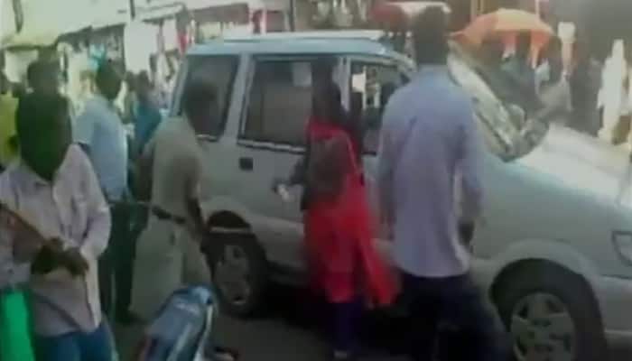 Watch: Male cop, two others mercilessly beat woman on road with sticks