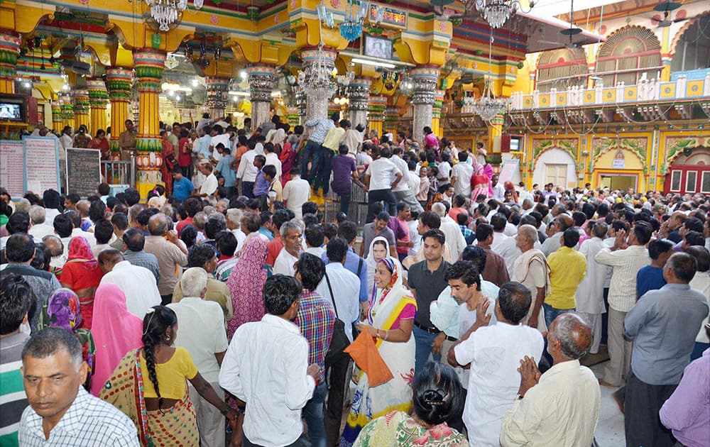 Devotees gather at Dwarkadheesh temple to offer prayers on the occasion of Janmashtami festival in Mathura.