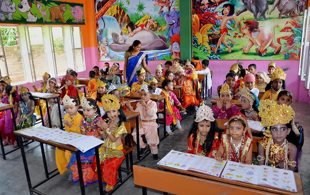 School children dressed up as Lord Krishna during Janmashtami Festival celebrations in Mirzapur.