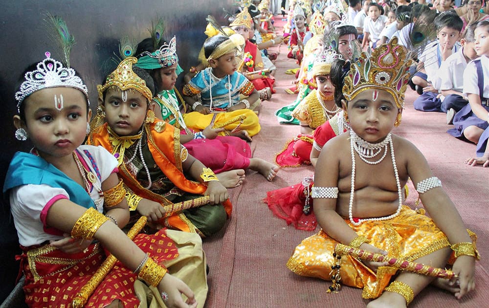 School children dressed up as Lord Krishna during Janmashtami celebrations at a school in Balurghat in South Dinajpur district of West Bengal.