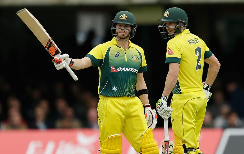 Australia’s Steven Smith celebrates making his half century, with Australia’s George Bailey during the One Day International cricket match between England and Australia at Lord's Cricket Ground, London.