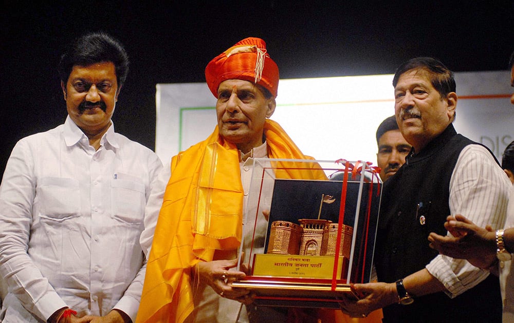 Union Home Minister Rajnath Singh is felicitated at a conference at Nehru Sanskrutik Bhavan in Pune.