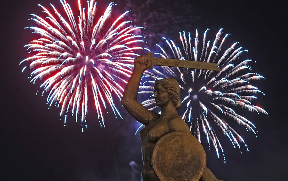 Fireworks explode behind the statue of the Mermaid, Warsaw's symbol, during a show in Warsaw, Poland.