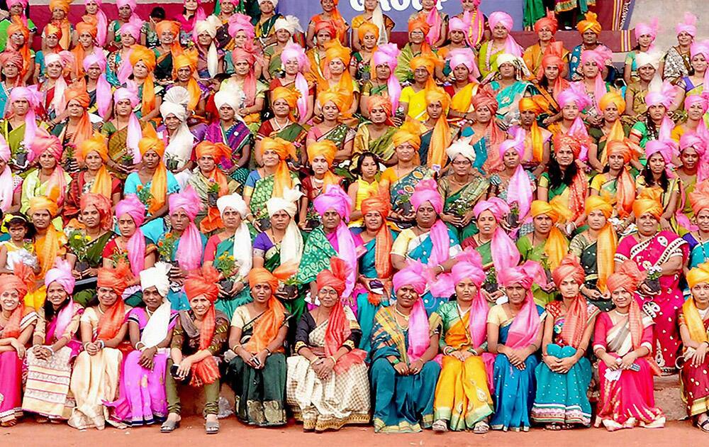 Women teachers wear Phetas which were presented to them during a felicitation function on the occasion of Teachers Day at Akluj in Solapur district of Maharashtra.