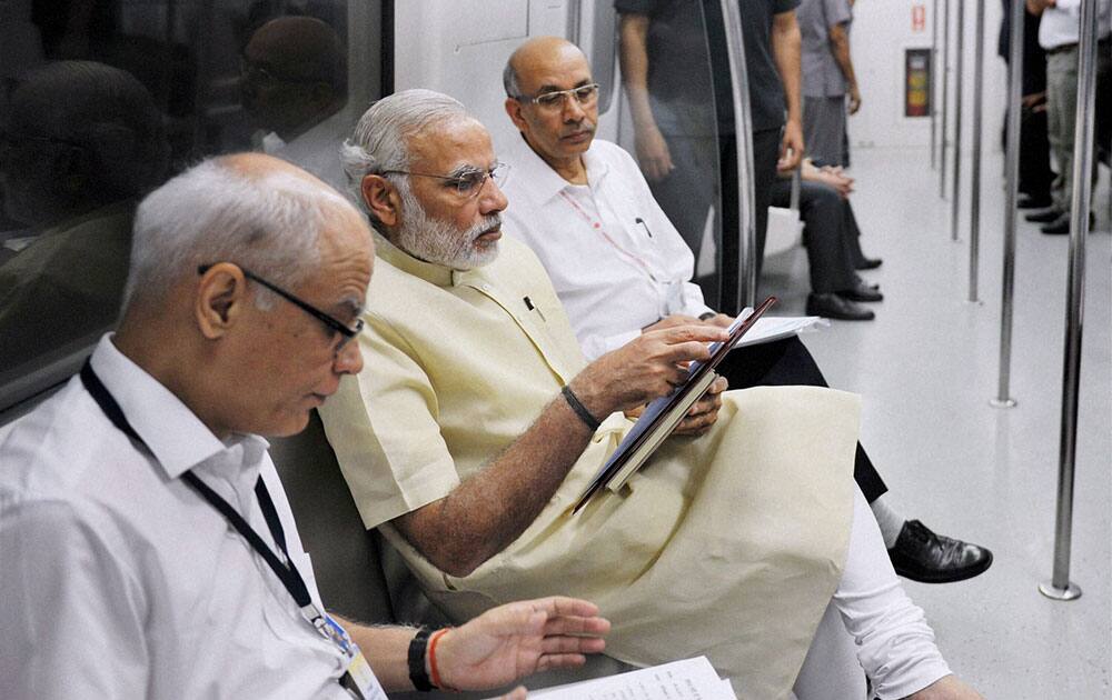 Prime Minister Narendra Modi takes the Metro from Janpath to Faridabad during the inauguration of the Badarpur-Faridabad Metro Line.