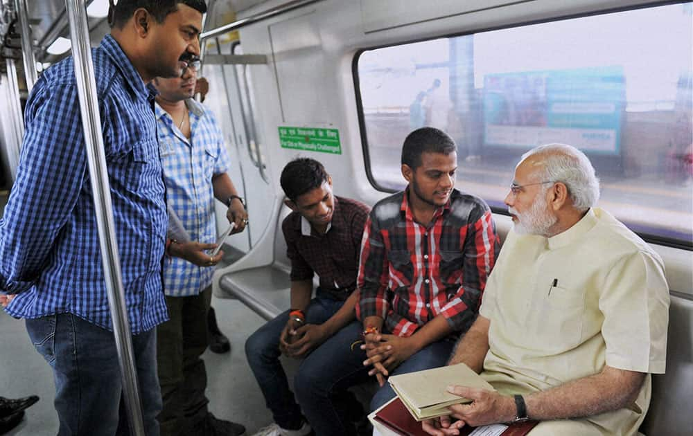 Prime Minister Narendra Modi interacting with co-passengers while travelling by Metro from Janpath to Faridabad.