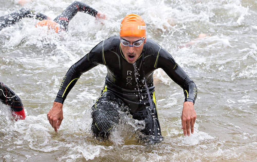 A swimmer leaves the water during the Elite Men's Championship at the ITU World Triathlon Grand Final in Edmonton, Alberta.