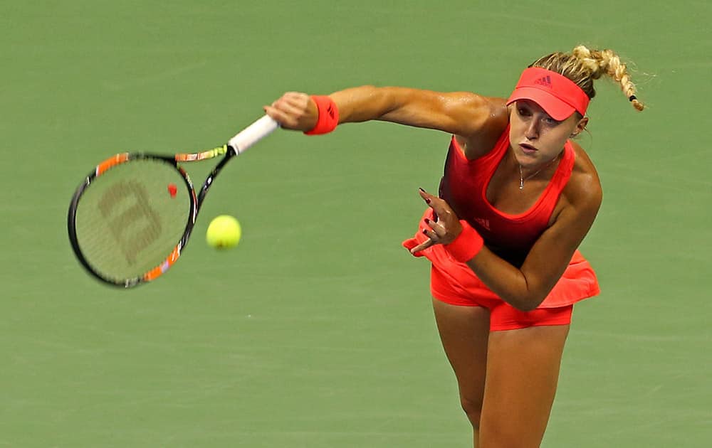 Kristina Mladenovic, of France, serves to Ekaterina Makarova, of Russia, during the fourth round of the U.S. Open tennis tournament.