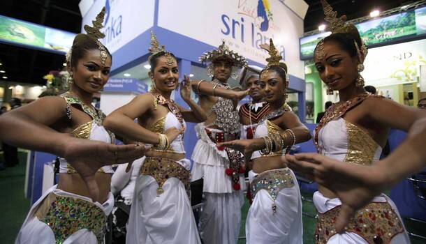 Srilankan dancers pose during the opening of the exhibition