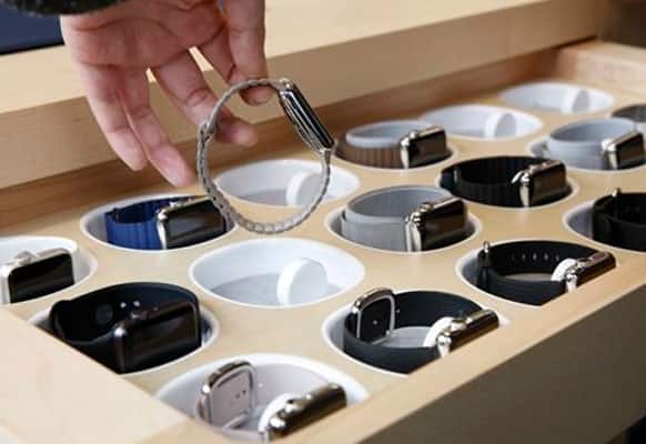 A customer picks up an Apple Watch at an Apple Store in Hong Kong Friday, April 10, 2015. From Beijing to Paris to San Francisco, the Apple Watch made its debut Friday.