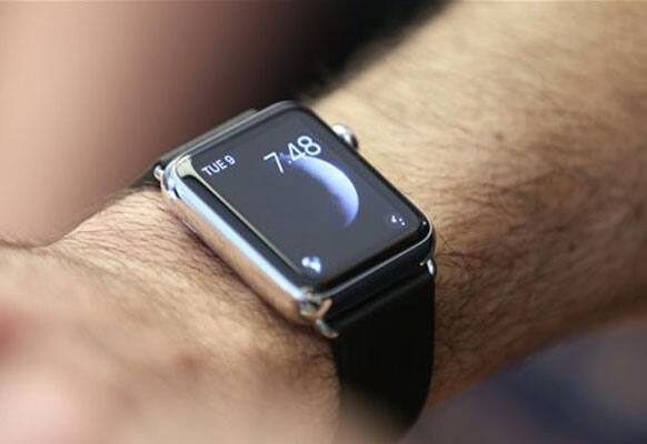 A customers wears an Apple Watch as the public have its first chance to see, touch and pre-order the watch in Sydney, Friday, April 10, 2015.