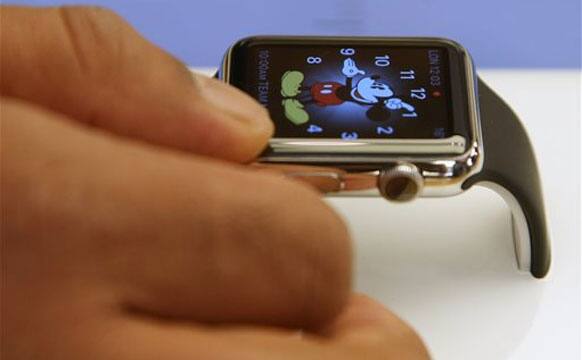 A customer handles an Apple Watch as the public have its first chance to see, touch and pre-order the watch in Sydney, Friday, April 10, 2015.