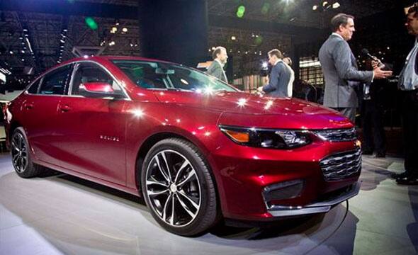 Mark Reuss, second from right, President of General Motors North America, is interviewed after the introduction of the 2016 Chevrolet Malibu Hybrid at the New York International Auto Show, Wednesday, April 1, 2015.