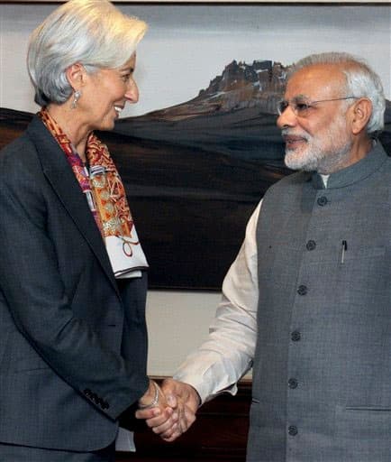 International Monetary fund chief, Christine Lagarde, left, shakes hands with Indian Prime Minister Narendra Modi during their meeting in New Delhi, India, Monday, March 16, 2015. 