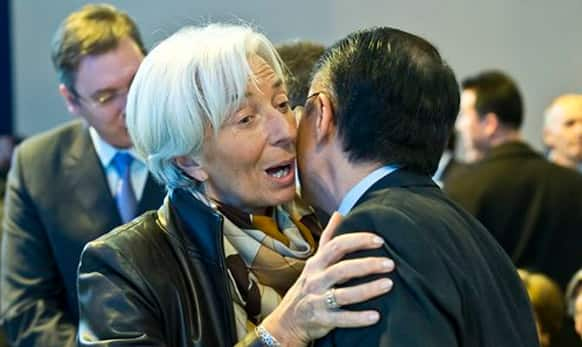 Managing Director of the International Monetary Fund Christine Lagarde, left, greets World Bank President Jim Yong Kim during the World Economic Forum in Davos.