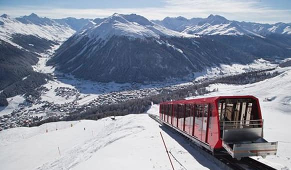 A cable train makes its way up the Weissfluhjoch mountain in Davos, Switzerland, Monday, Jan. 19, 2015.