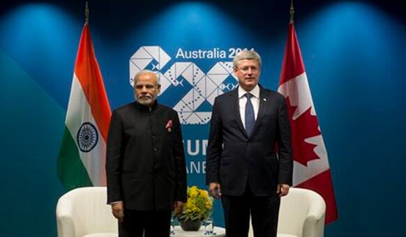 Canada Prime Minister Stephen Harper stands with Indian Prime Minister Narendra Modi before a bi-lateral meeting at the G20 Summit in Brisbane, Australia.